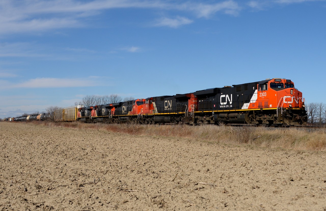 Train 394 heads east out of Sarnia with lots of power, CN 2303, 2627, 2886,2921 and 2259.