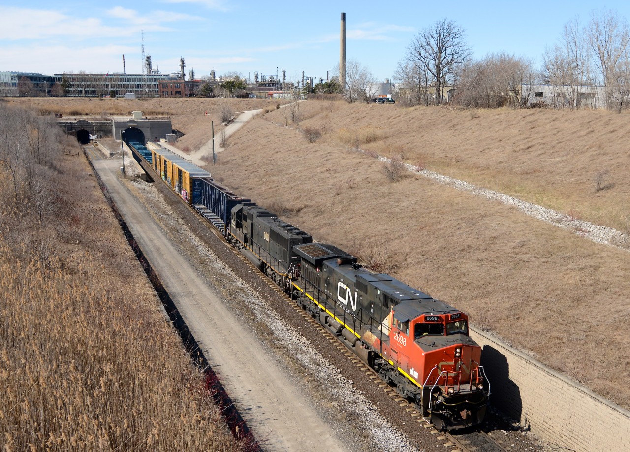 Train 504 with CN2698 and IC 1011 and a short cut of cars pull into Sarnia through the "Paul M. Tellier" St. Clair River Tunnel.