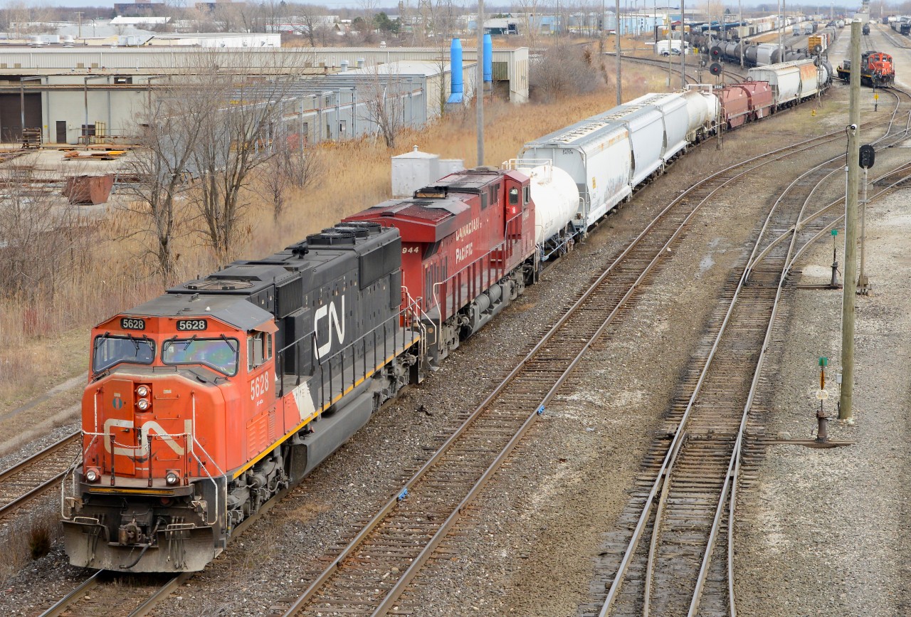 CN 5628 leads the way with an unexpected visitor in Sarnia today as CP 8944 is the trailing unit on train 385.