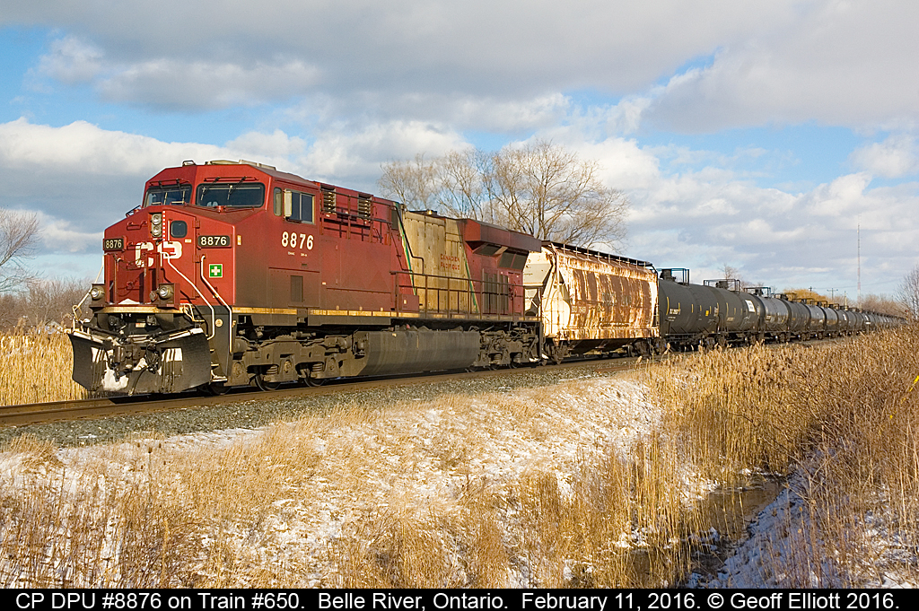 CP Train #650 rolls through Belle River, Ontario on February 11th with CP DPU 8876, a former Vancouver Olympics unit, shoving hard on the rear.  Decided to grab this as it went by while I was waiting on CP #647 to depart west with a KCS unit trailing.