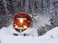 CN 595 rounds the bend at Utterson after a fresh snowfall on one of its twice-weekly trips down to Longford Mills.