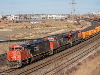 With its third Cowl leader in less than a week, 149 rounds the bend and comes under the Hopkins Street overpass.

CN 2443, CN 2892, CN 2881