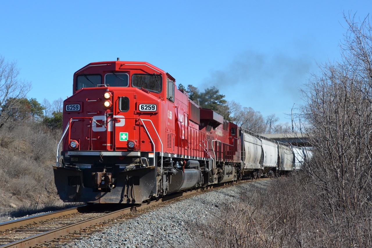 One of three CP painted SD60Ms lead CP 255 North out of Desjardins