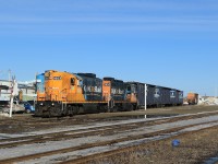 After pulling a few loaded centrebeams out of the Tembec Sawmill, 1603 and sister unit 1601 push empties back into the plant for future loading.