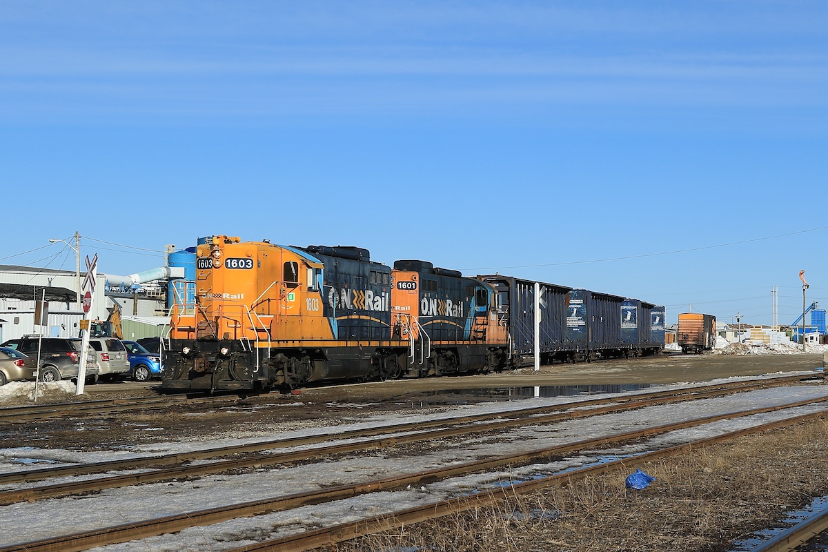 After pulling a few loaded centrebeams out of the Tembec Sawmill, 1603 and sister unit 1601 push empties back into the plant for future loading.