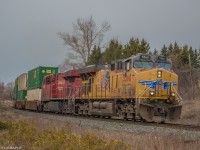 CP 142 rounds the bend with a UP leader, heading East, on approach to Darlington.


UP 5360 & CP 8854