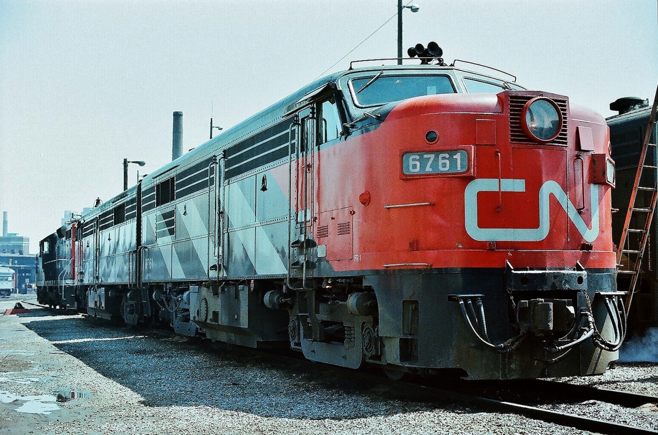 At the time,  THE place to Railfan 


The smell and sounds of  Alco - MLW power. 


Four decades ago. 


1958 built MLW  FPA-4  #6761 is MU'd with one of two FPA-2u (the original 244 engine (1600 HP) replaced with the 1800 HP Alco 251B engine) on the CN roster CN#6758 


Also present is FPA-4 6774 and FP9A 6539, and that ladder is leaning on the B end of another FP9A.


 June 1977 at the CNR Spadina service facility and roundhouse. Kodak negative film transported in a Nikkormat EL, by S.Danko.


p.s. Even in 1977 this lashup was unique enough to ignore normal photography protocol and shoot the  shady  – back lit - side of these units....please note: achievable only because of the phenomenal exposure latitude capabilities of colour negative film !


 more Spadina:


 MLW 6758  


 a contrast of yellow and cab design 


 cab design  


 sdfourty