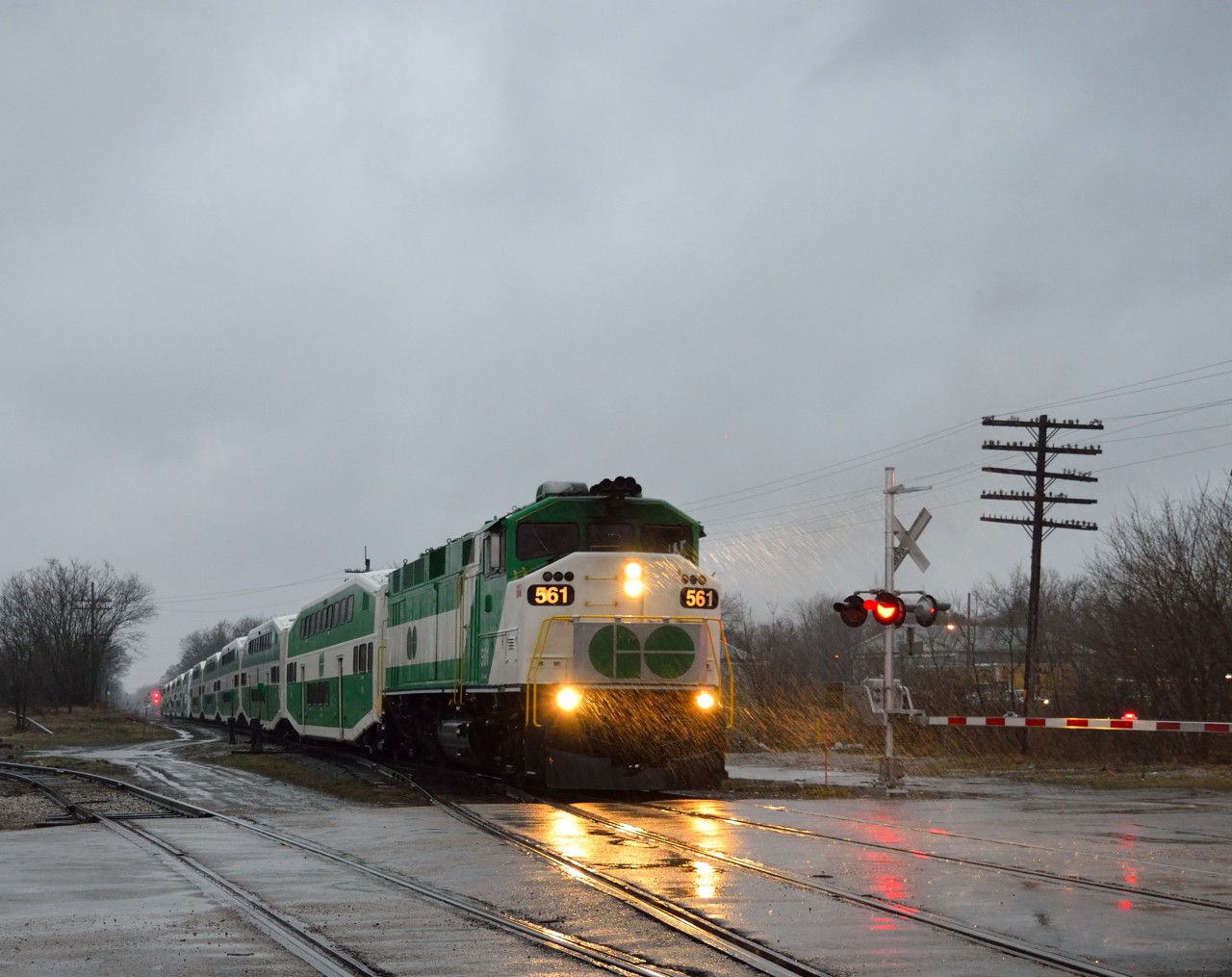 In the early morning rain, L10L heading east!  After receiving a heads up from Steve Host (thanks again!) of GO F59PH's on a GO train in Kitchener, I took a chance and shot the second GO train, not knowing if the F59's were on the first.  Luck was on my side, as GOT 561 and GOT 557 sandwich 10 bi-level cars in the "classic" GO paint, at Alma Street.With the new MP54's on the way, who knows how much longer these F59's will remain in service.