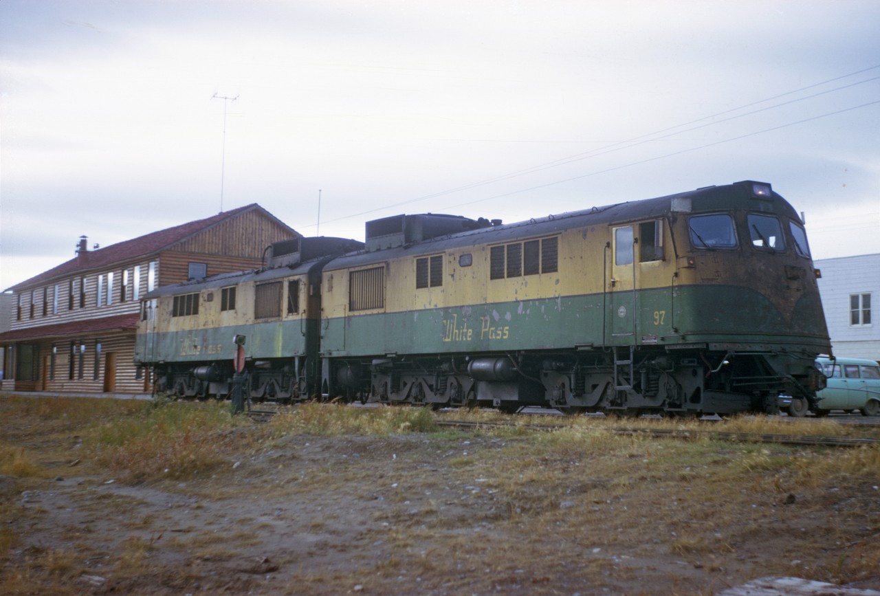 Two General Electric Diesel engine at the White Pass & Yukon Route headquarter in Whitehorse, Yukon. The picture were made back in August 1971. At this time, there were a lot of fire in the Yukon. The visibility was not the best, as the image show the dust, too. Photographer unknown. Original slide in the collection of Boerries Burkhardt. http://www.whitepassfan.net
