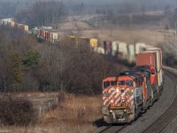 With a day full of rain and thundertorms, I didn't think I'd get a good shot of 149..  Despite the weather, I went out to shoot 149.

Only a few short minutes before 149 shows itself, the first speck of sunlight appears through the clouds. 149 rounds the bend at Newtonville with a clean BC Rail cowl on point. 

BCOL 4622, CN 5524, IC 2705


