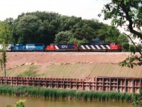 It has been 10 years already since the construction for the third rail thru Bayview was under way. So there opened the chance to shoot from an old angle once again, before foliage sprung up after the hillside landscaping was completed. Here is CN 5442, 6021 and NREX 8696 (in CR paint) with train #338, a CSX/Buffalo to MacYard daily, slowly making its way thru the work zone. There is currently a 5442 on the roster, but it is not this one. :o)