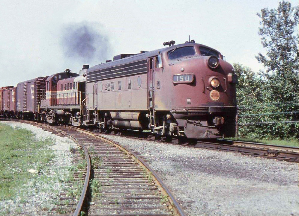 At a time when CP was short of power CGW F7 150 and CP RS-3 8449 power an eastbound at Bowmanville. The same day, June 22/66, MLW S-2 7093 was used on the Trenton way freight. Yard engines were rare this far out on the mainline and likely an unpopular idea with the crew.