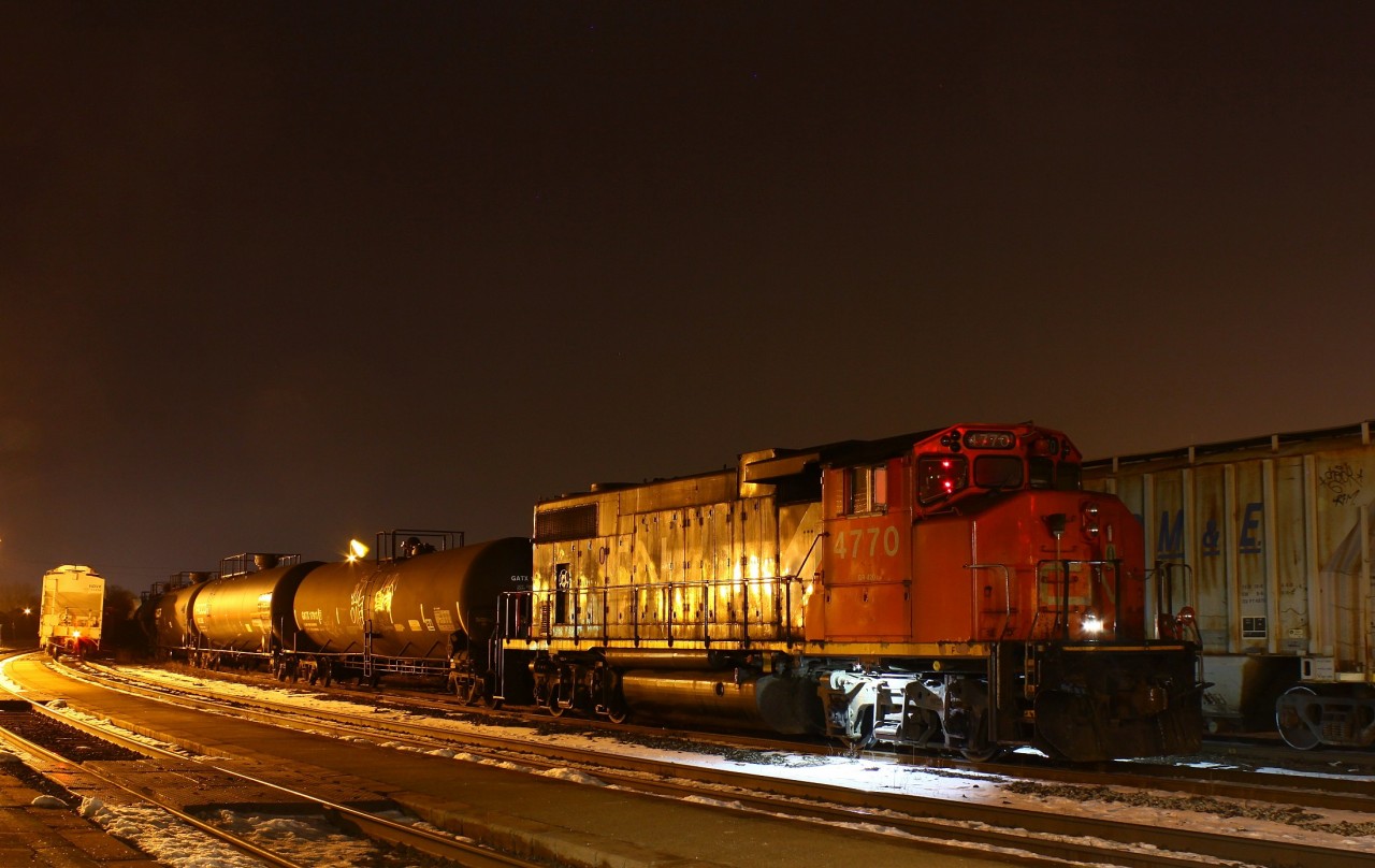 Night time in BrantfordTonight I guess the crew decided to park the GP in a much more convenient location for me, as seen above. I didn't hesitate to take advantage of this. I don't ever recall ever seeing the yard power tied down here, but CN seems to be shaking things up (at least from my perspective) a little in the area. For example taking a set of GP's out of London, and I saw a video (https://www.youtube.com/watch?v=JIzn21i_3TY) where 4770 on 580 went all the way to Woodstock earlier in the week. Maybe they're using this one more so the don't bother parking it in the usual spot? Don't mistake this for complaining though!!Also tonight, you can see 435's SBU over to the left. On the way over I heard on the scanner that the lead unit (2293, I think) was having a lot of brake issues. I understand that the engineer couldn't control the brakes properly from this unit. He ended up isolating the lead unit completely, meaning he was controlling the train from the second cab, while the conductor acted as the eyes in the lead cab. The original plan was to use this set up to Paris where they'd leave the lead unit and continue on their mary way to London. However the plan changed to the crew tying down the entire train at Paris and calling it a day. Bet that'll screw up some plans for tomorrow!!