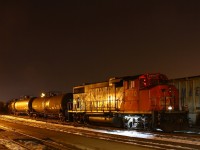 <b>Night time in Brantford</b><br>Tonight I guess the crew decided to park the GP in a much more convenient location for me, as seen above. I didn't hesitate to take advantage of this. I don't ever recall ever seeing the yard power tied down here, but CN seems to be shaking things up (at least from my perspective) a little in the area. For example taking a set of GP's out of London, and I saw a video (https://www.youtube.com/watch?v=JIzn21i_3TY) where 4770 on 580 went all the way to Woodstock earlier in the week. Maybe they're using this one more so the don't bother parking it in the usual spot? Don't mistake this for complaining though!!<br>Also tonight, you can see 435's SBU over to the left. On the way over I heard on the scanner that the lead unit (2293, I think) was having a lot of brake issues. I understand that the engineer couldn't control the brakes properly from this unit. He ended up isolating the lead unit completely, meaning he was controlling the train from the second cab, while the conductor acted as the eyes in the lead cab. The original plan was to use this set up to Paris where they'd leave the lead unit and continue on their mary way to London. However the plan changed to the crew tying down the entire train at Paris and calling it a day. Bet that'll screw up some plans for tomorrow!!    