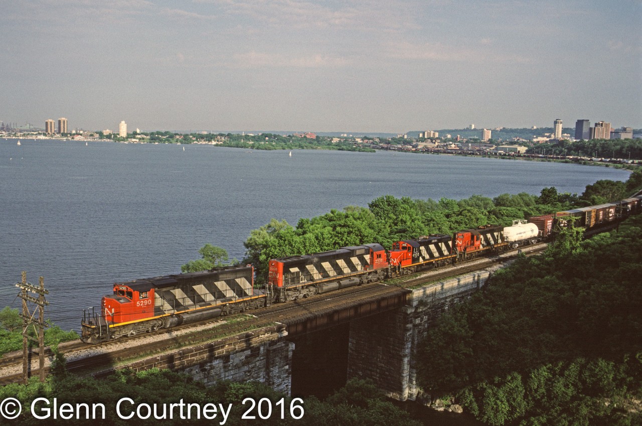 CN SD40-2W 5290 leads Fort Erie - Toronto train #432 out of Hamilton, just crossing the Desjardin Canal, on a beautiful summer evening in 1989. I believe that this is one of the very few times I cut a freight coming out of Hamilton on a summer evening making this shot possible with light on the nose.