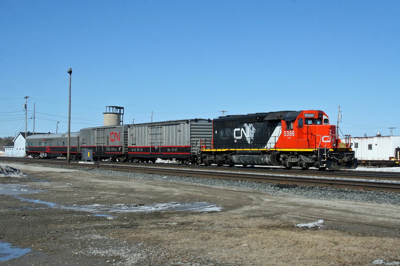 After testing the Caramat Sub from Armstrong to Hornepayne, CN O 99841 19 idles outside the station/office, at roughly the mid-way point of its journey across Northern Ontario.  Veteran SD40-2 CN 5386 has the honours of leading CN's newest TEST, which consists of CNA 415867, CN 414852 and CN 1057, formerly the Louis Jolliet business car.  After spending a night in "The Payne", the train will resume its journey eastwards across the Ruel Sub to Capreol and south to Toronto before heading east for the Maritimes.