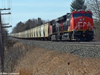CN 3001 leads 730's train through the swale at Salem, Ontario. CN 2893 trails and 2903 brings up the markers 153 cars back. 1222hrs.