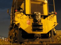 <b>Under a Full Moon at Bramalea</b>: CN Plasser Dynamic Track Stabilizer (PTS-90) 619-32 sits on the long-disused but recently trimmed siding to logistics distributor Kuehne + Nagel's Bramalea warehouse, near the namesake GO station. It is but one piece of track equipment in the area working on the then-ongoing triple tracking of the Halton Sub through Brampton. <br><br> The little piggy strapped in front of the Pyle National dual sealed beam headlight was no doubt the work of one of the track gang members...