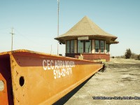 <b> WHO ARE YOU GONNA CALL? </b> Driving through the day before, it was a surprise to see such activity at the Jarvis train station. Originally built around 1907, it replaced an earlier two storey structure that was built on the opposite side of the tracks. What made it unique, was not one, but two operators bays at the front and back. It was considered a 'union' station, because the two lines that eventually became part of the CNR network, were in fact built by the Great Western Railway (Cayuga Sub. - also referred to the Air Line) and the Hamilton & Northwestern Railway (Hagersville Sub). 
<br>
The last of the rails - the Cayuga Subdivision - was eventually abandoned and then subsequently torn up around 1996....and no train stopped at it's platforms since, well, I don't know when other than to say years before! It's uniqueness always greeted passengers from the front on the Cayuga Sub., and also from the back on the Hagersville Sub. And, as a young railfanner who is always intrigued by the architecture of these buildings, it was always a treat to see the station as we arrived in Jarvis on our way to Port Dover, Simcoe, etc.
<br>
When CN was done with the building, it housed a couple of businesses. First, there was the "Neat Little Bookstore"...and the last owners was Michaud Fine Woodworking. However, due to the huge successes of Michaud's, they required bigger space to manufacture and showcase their handmade wooden games. Therefore putting the half-renovated station up for sale. Whats in store next? The station obviously is on the move, and if anyone has information as to where please pass it on! A Tim Hortons will soon occupy what will have to be termed as the 'former station site', thus ending over 100 years of railroad history in the town of Jarvis.