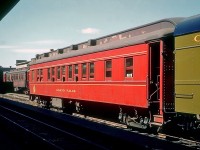 Canadian National Railways sleeping car "Grand Falls". still wearing its Newfoundland Railway colours three years after Newfoundland became Canada’s 10th province, is seen in St. John’s July 29, 1952.  Built by National Steel Car in 1928, it was one of the three oldest sleeping cars in the fleet.  It was fitted with 8 sections and 1 drawing room and, like all Newfoundland Railway passenger cars, was not air-conditioned.  Passengers  in a lower berth could open the lower sash a few inches exposing a fine mesh screen which kept out most, but not all, of the smells and sounds of steam-powered railroading.
<br><br>
<i>[Note: geotagged location not exact]</i>