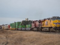 CP 142 cuts through the fields of Newtonville with a clean foreign unit on point.

It's nice to catch a UP unit that is actually still yellow ;)



  
