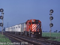 CP Rail GP38-2 3046 splits the signals at Hornby with the Roadrailer train, #529, running on the south track to run around the GO trains using the north track.