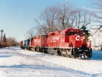 By Mile 1, meaning one mile from the bridge over the Niagara River and the USA, CP 5916, 5502, CRL 611, SOO 760 and CP 4214 are seen having just passed thru the commercial/tourist district of Clifton Hill. Palmer Av is the street which parallels the tracks. The old trackbed is now a walking trail.