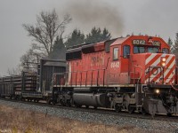 On a cloudy and rainy day, CP 6042 leads an Eastbound Rail train desitned for Montreal.