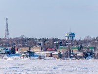 CP 8793 acts as mid train DP on an eastbound stack train under Sudbury's iconic water tower (which is still for sale). Photo taken looking north from Laurentian Bay on the south shore of Lake Ramsey.