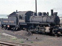 Canadian Pacific Railway 6275, a U3e class 0-6-0 build by CP's Angus Shops in 1912, sits at CP's Goderich terminal facilities in 1958, just ahead of the turntable for the roundhouse. <br><br> According to <a href="http://www.trainweb.org/oldtimetrains/CPR_London/Gallery_power.htm"><b>Old Time Trains</b></a>, the 6275 was the last 0-6-0 anywhere on the CPR system at the time, and made its last run on December 6th of that year. It was briefly replaced by an S3 until the new regular Goderich assigned unit 17 (a new CLC DT2 siderod switcher) arrived. Rather than being cut up for scrap, 6275 is now preserved inside the Huron County Pioneer Museum in Goderich. The CPR's Goderich yard, roundhouse and trackage have all been removed, but the old station survives.