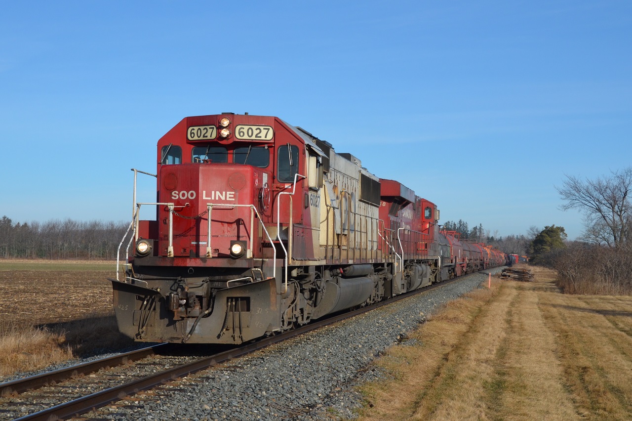 In perfect morning light, CP 246 heads South from Guelph Jct. with a storage evading SOO SD60 on point. Big thanks to Steve Host for the ride.