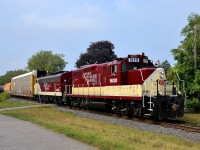 After picking up cars at Putnam and Ingersoll, the OSR Woodstock job is heading to Woodstock to interchange with CP as it heads east. Power is a pair of vintage GMD products in matching paint: GP9 1620 and FP9 6508. 