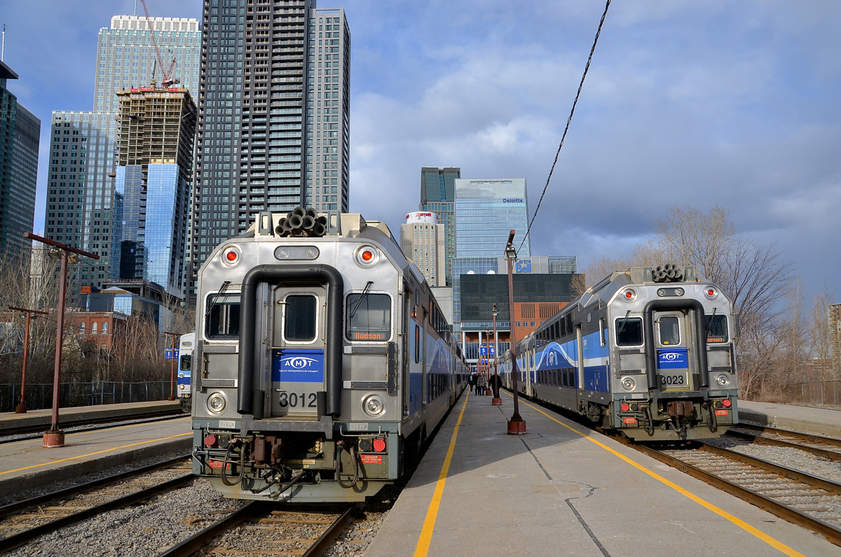 Bound for Hudson and Vaudreuil. Two Vaudreuil-Hudson AMT trains are boarding passengers at Lucien L'Allier station during the evening rush hour in downtown Montreal. AMT 111 at left will go all the way to Hudson (the only train to go that far all day) while AMT 25 at right will go to Vaudreuil.