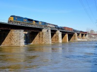 <b>CN 327 over the river.</b> CN 327 is crossing over the Ottawa River with new ET44AH CSXT 3284 leading and CSXT 5101 trailing.