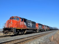 <b>A CN local on the Kingston sub.</b> While CN's busy Kingston sub between Montreal and Toronto is dominated by VIA Rail passenger trains and CN through freights, it's still possible to see CN locals here and there. An example here is CN 538, heading west on the Kingston sub with 12 cars for Coteau, with a trio of elderly geeps for power (CN 9418, CN 4102 & CN 4723).
