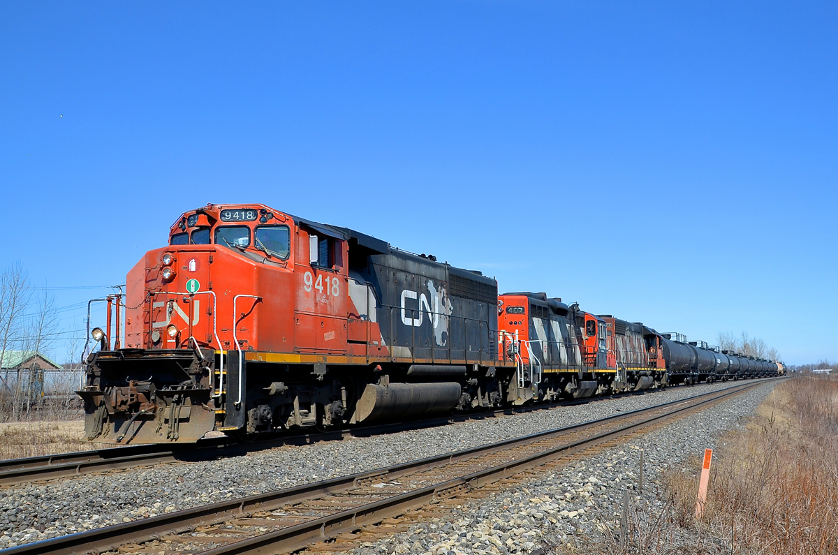 A CN local on the Kingston sub. While CN's busy Kingston sub between Montreal and Toronto is dominated by VIA Rail passenger trains and CN through freights, it's still possible to see CN locals here and there. An example here is CN 538, heading west on the Kingston sub with 12 cars for Coteau, with a trio of elderly geeps for power (CN 9418, CN 4102 & CN 4723).