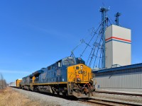 <b>Past the mill.</b> CN 327 has new ET44AH CSXT 3284 leading and CSXT 5101 trailing as it passes a mill in Huntingdon, which is still served by rail.