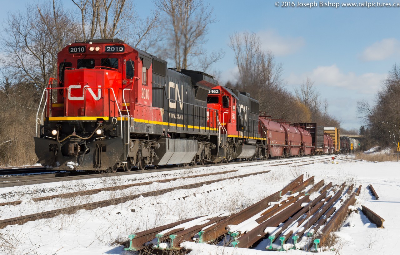 CN 331 accelerates up grade at Copetown with a pair of standard cab units in the form of CN 2010 and CN 5462 on a sunny February morning.