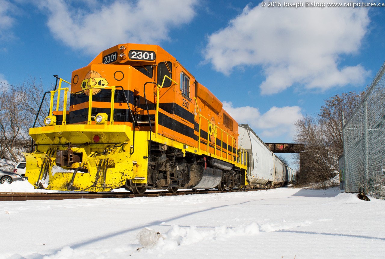 While sitting in a lecture this morning boredom got the best of me ...to my surprise I heard RLHH 496 was on their way to Brantford to work Ingenia. After finishing class I caught up with QGRY 2301 and 6 hoppers at the yard in Brantford. The crew would wait for CN 148 to pass before heading to the Burford Spur. They are pictured stopped at Brant Foods for their lunch break which allowed me to grab a couple shots. I would shoot them in 4 more locations before throwing in the towel and going home.
