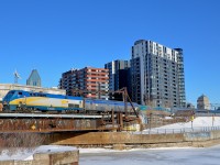 <b>Past Wellington Tower.</b> VIA 919 pushes deadheading VIA 63 towards Montreal's Central station and past the out of use Wellington Tower.