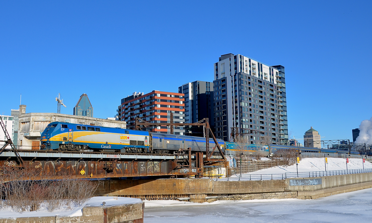 Past Wellington Tower. VIA 919 pushes deadheading VIA 63 towards Montreal's Central station and past the out of use Wellington Tower.