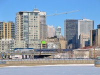 <b>Disappearing into downtown Montreal.</b> The deadheading <i>Adirondack</i> seems to be disappearing into the skyline of downtown Montreal as it deadheads towards Montreal's Central Station on a bright but cold morning.