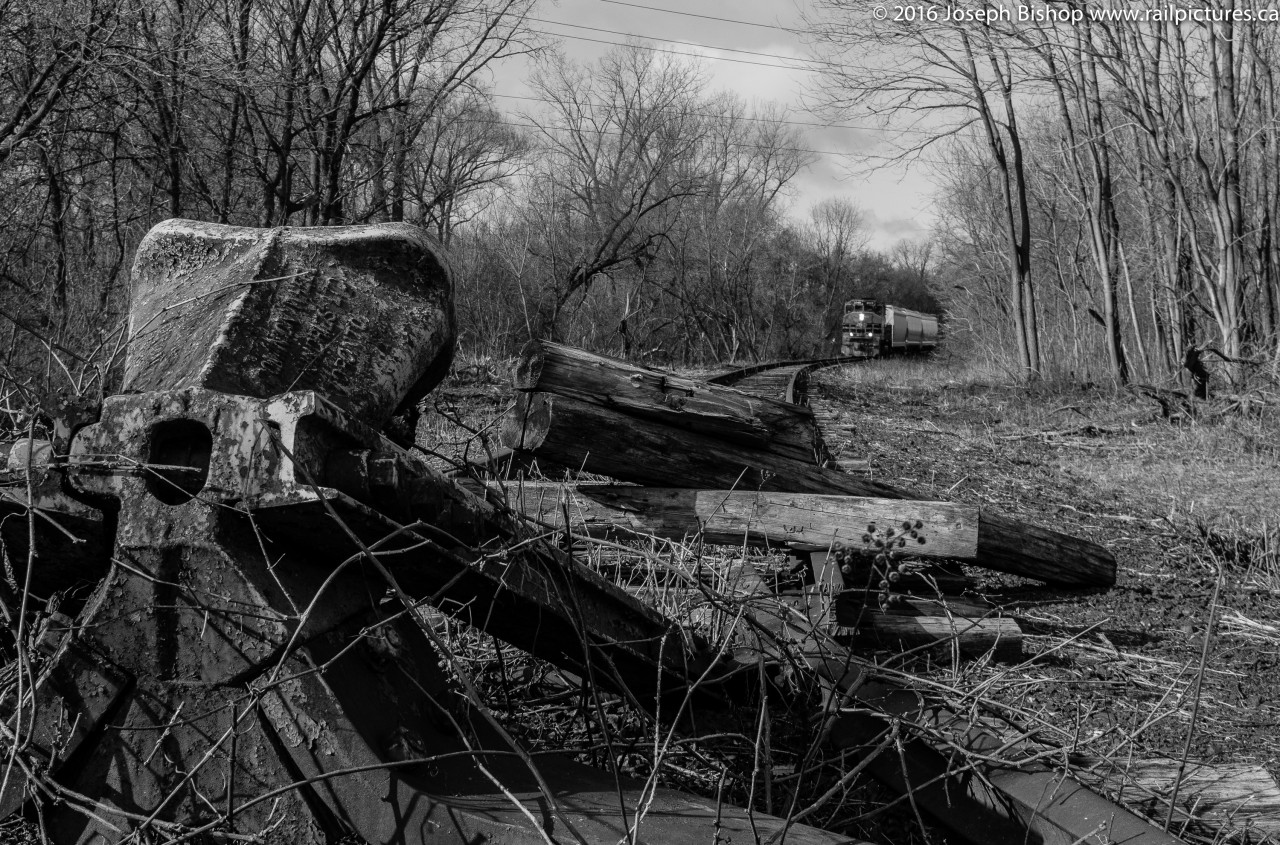 End Of The Line RLHH 3049 shoves back into the Ingenia Polymer Plant in Brantford.  In the foreground is the track bumper to mark the end of the Burford Spur.  A short walk down the rail trail walking path allowed for me to take this shot.
