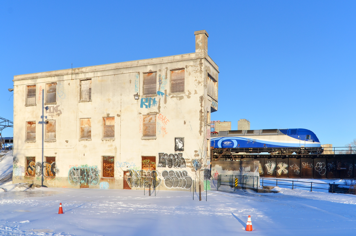 Seen better days. Wellington Tower, out of use for about 15 years now is looking rather forlorn as AMT 1359 leads AMT 814 past it on a sunny evening.