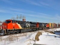 <b>Consecutively numbered ES44AC's.</b> ES44AC's CN 2921 & CN 2920 zip through Dorval with CN X371 in tow on a sunny morning.