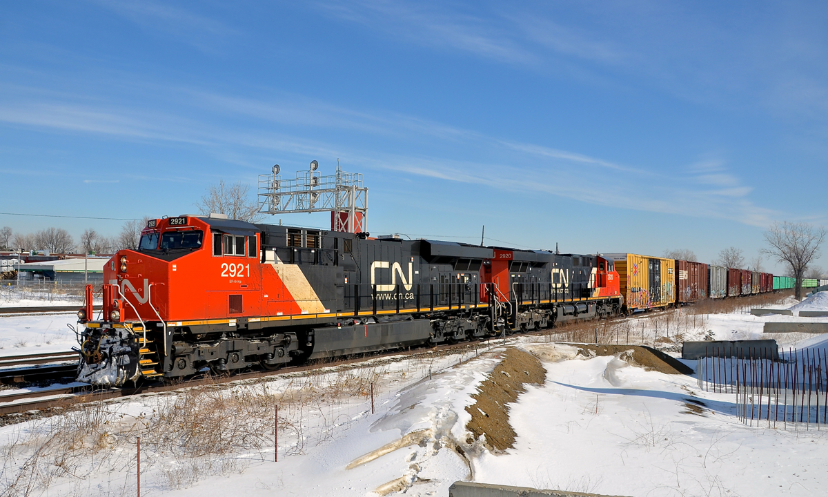 Consecutively numbered ES44AC's. ES44AC's CN 2921 & CN 2920 zip through Dorval with CN X371 in tow on a sunny morning.