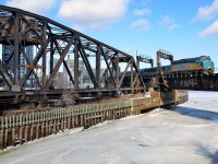 <b>Over the frozen Lachine canal.</b> VIA 55 for Toronto is passing Wellington tower and over the frozen Lachine canal.