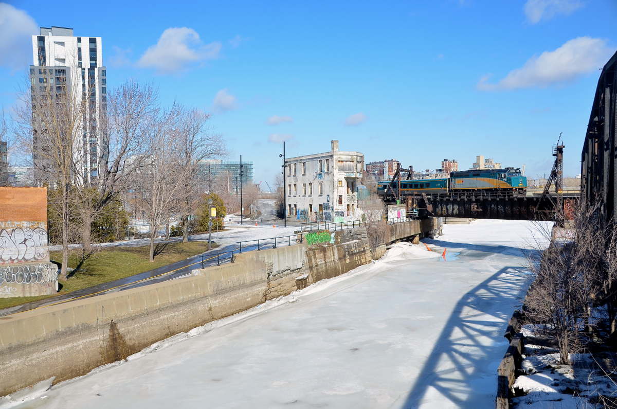 VIA 24 for Quebec City is passing Wellington tower and over the frozen Lachine canal.