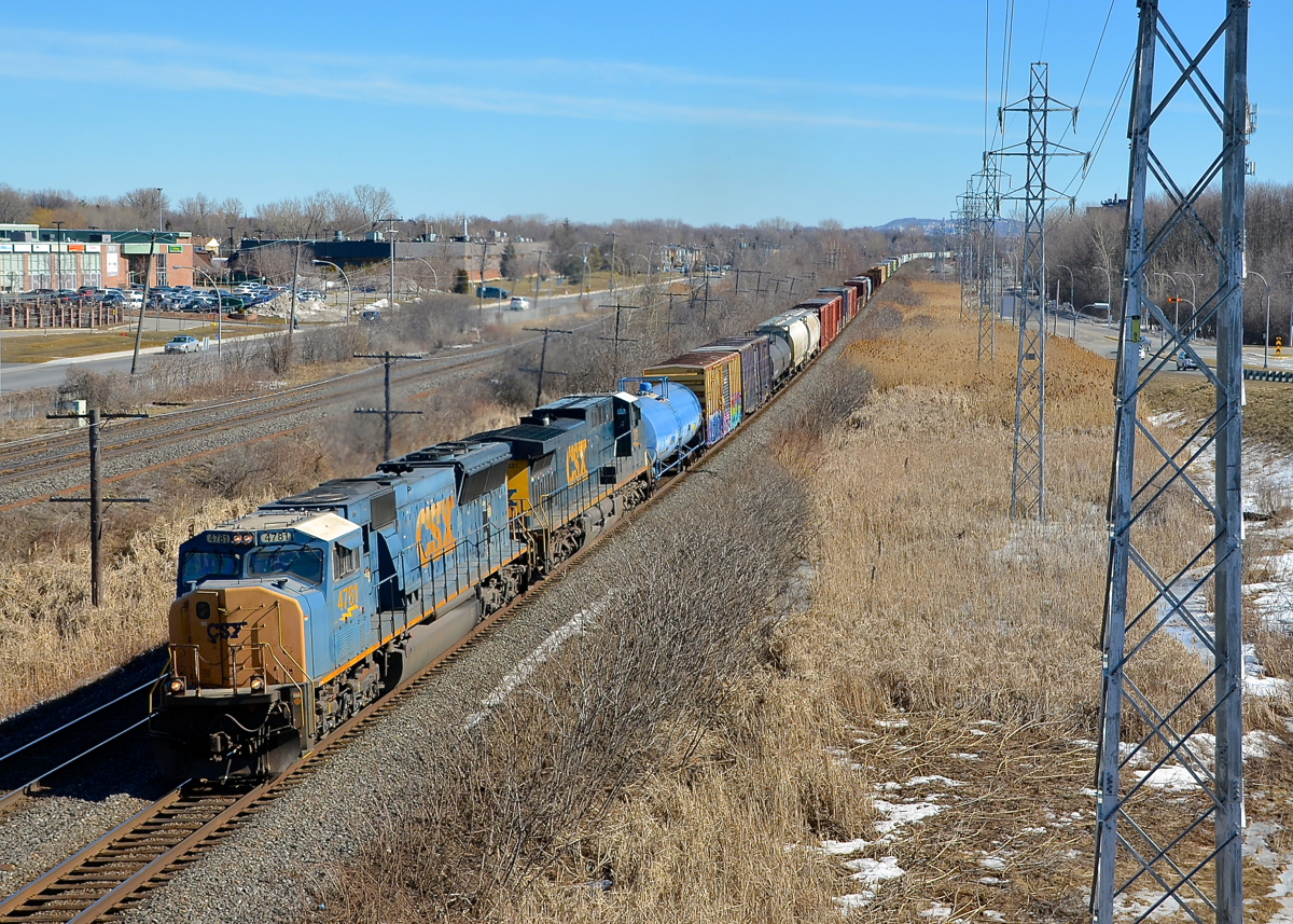 SD70MAC CSXT 4781 & AC4400CW CSXT 331 lead CN 327 through Pointe-Claire on CN's Kingston sub.