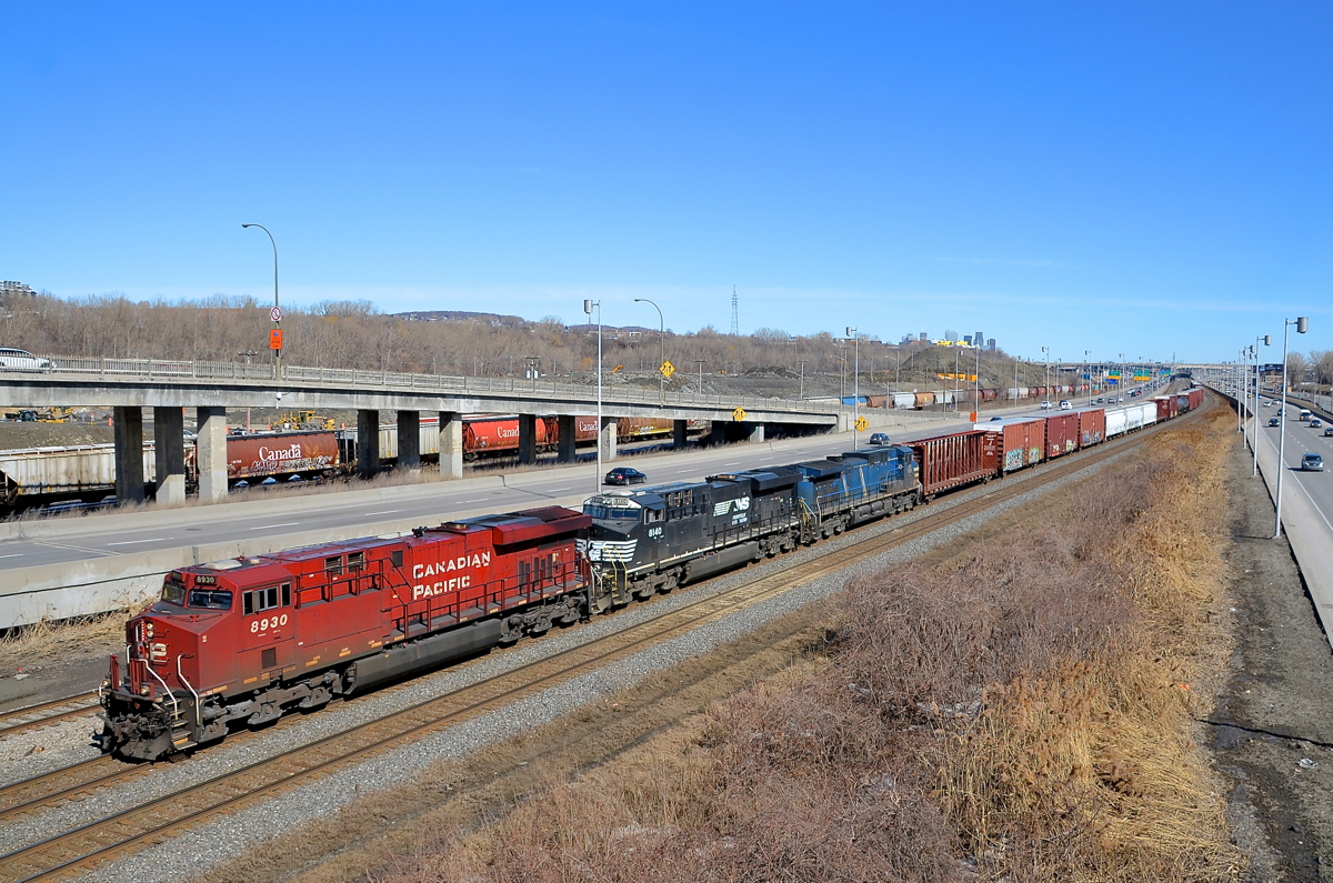 Red, black and blue. CN 529 has red, black and blue power and none of them are CN units (GE's CP 8930, NS 8140 & CEFX 1028) as it heads west on CN's Montreal sub on a gorgeous afternoon.